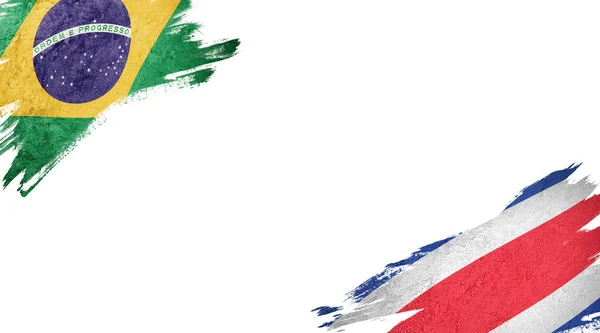 白を背景にブラジルとコスタリカの国旗 — ストック写真